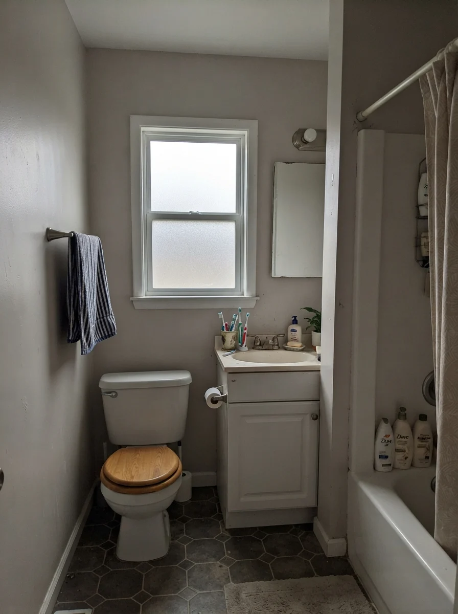 Small bathroom under flat overcast light with muted Shoji White walls